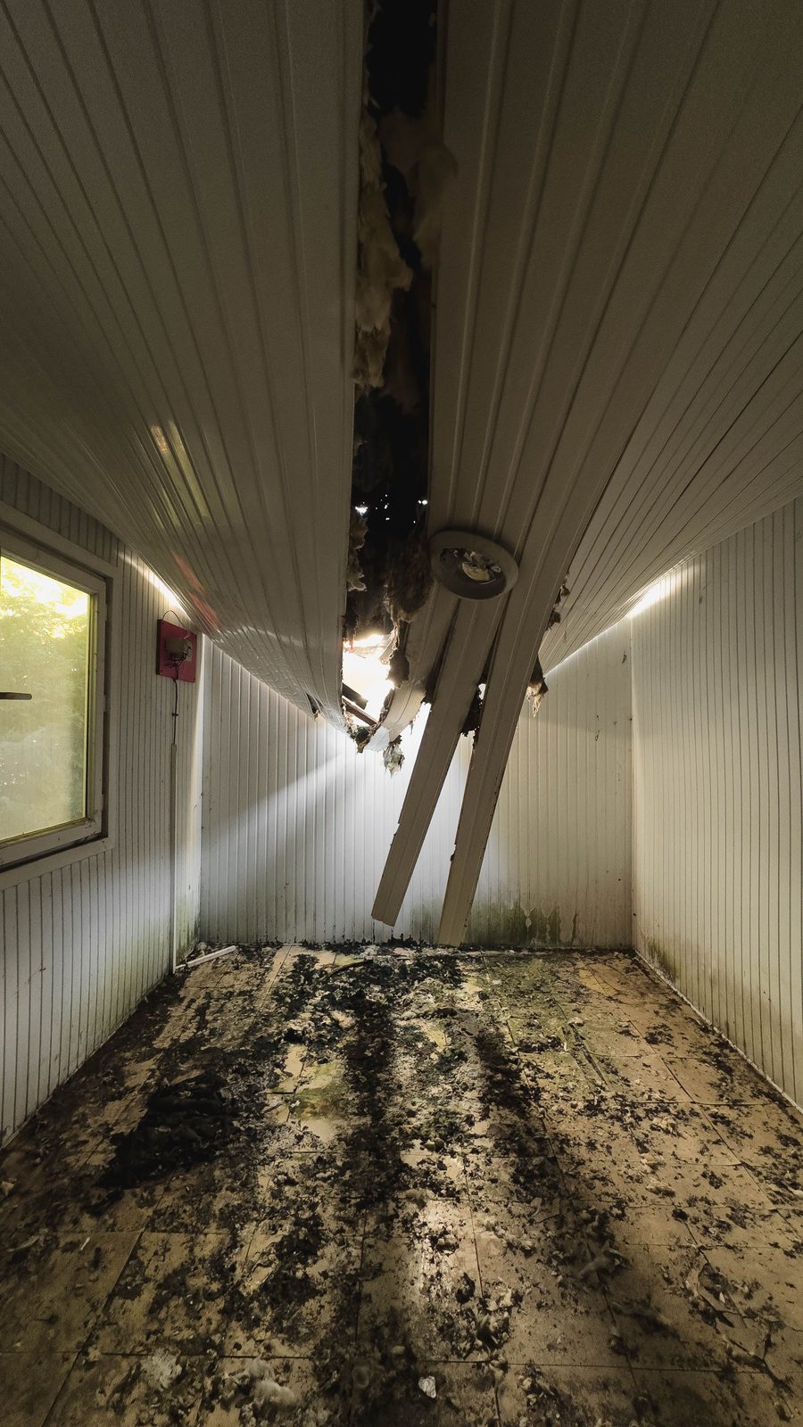Collapsed ceiling in a Country Club Hills bedroom after a second-floor bathtub overflow