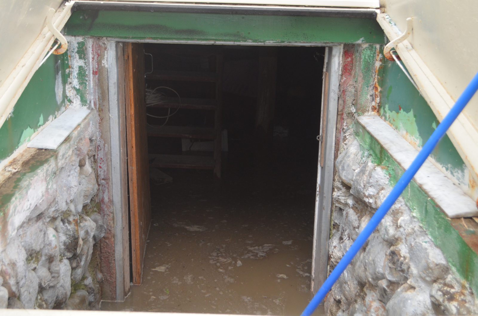 Basement stairs in Hazel Crest with standing water at the bottom