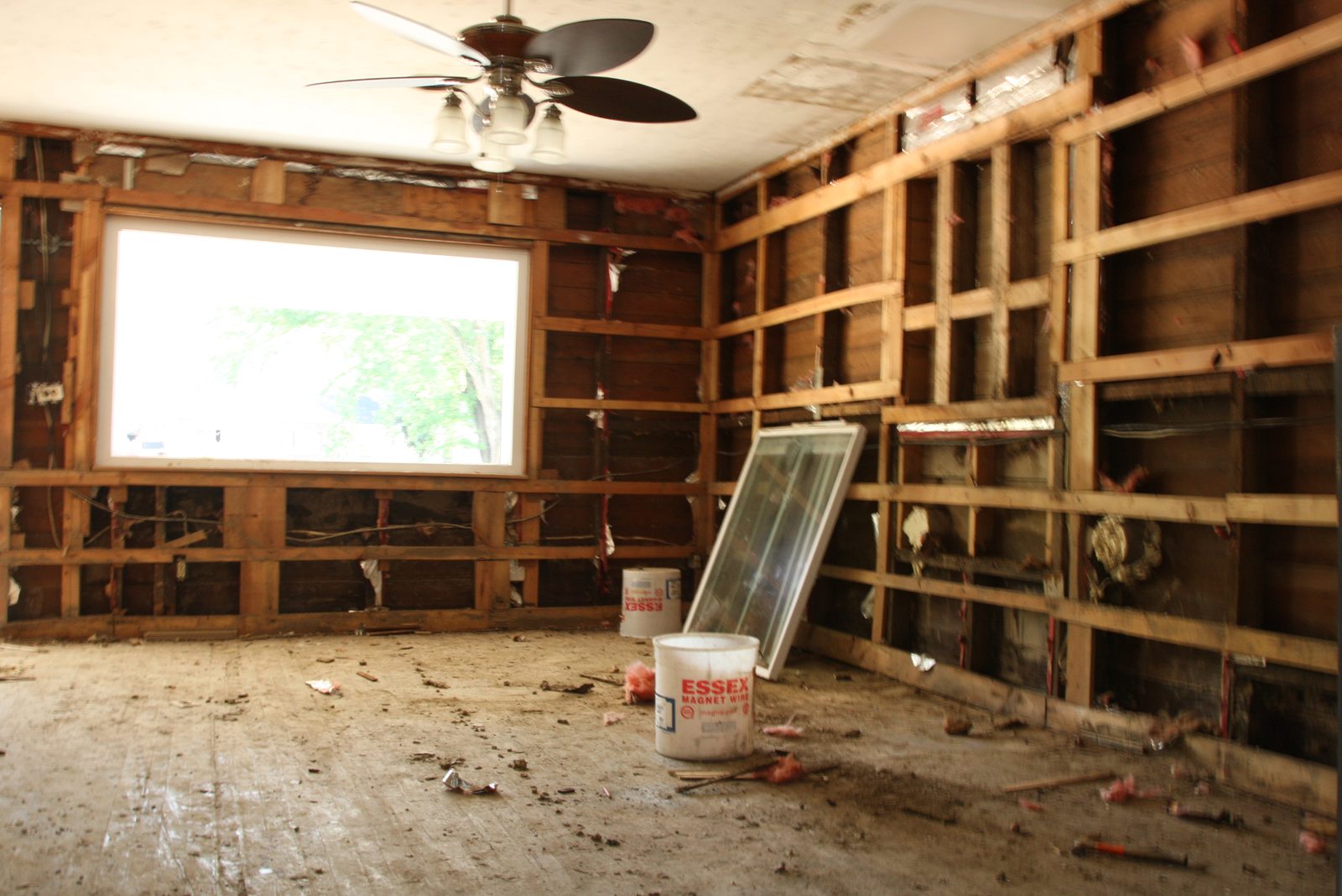 Kitchen in Olympia Fields opened to the studs and drying after a dishwasher line failure